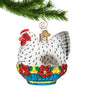 Glass French Hen Ornament sitting in blue basket of  poinsettia flowers hanging by a gold swirl hook from a Christmas tree branch