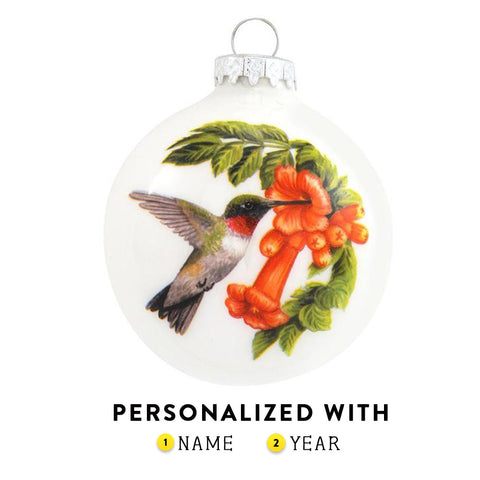 Hummingbird with flowers on front and the symbolism on the backside. Glass Ornament