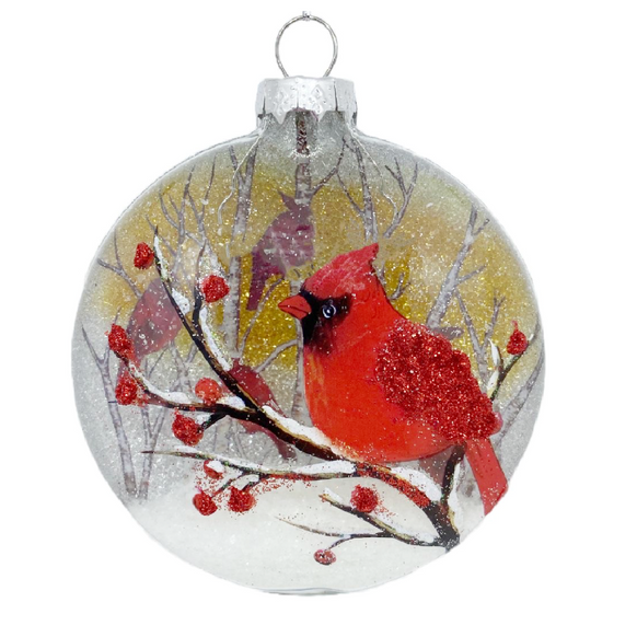 Round Glass Ornament with Cardinals in a snowy scene 