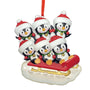 Penguin Family of 6 Christmas ornament with penguins sledding
