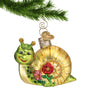 Glass Snail Christmas ornament hanging from gold swirl hook from a Christmas tree branch